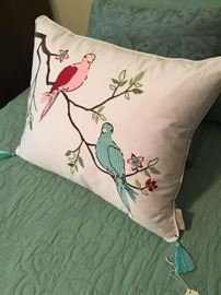 Close-up of pillows on twin beds.