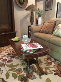 Beautiful antique mahogany coffee table with glass top,drawer on each end and one in center.