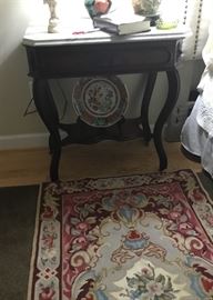 Mahogany end table with marble top.