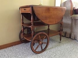tea cart - both sides can be flipped up to create a round, moving table