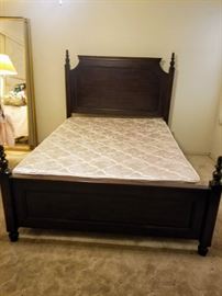 queen size bed with wood head and footboard