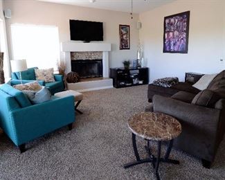Another sofa and super looking turquoise accent chairs.