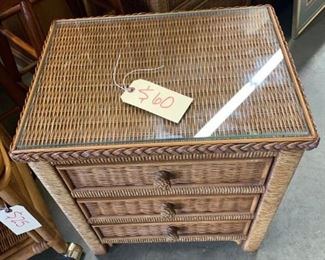 Henry Link wicker side table/night stand. Caramel color with glass top.     Finished on all sides.                               20"w x 15"d x 22.5"t      Excellent Condition.    $60   Also, matching lingerie chest.