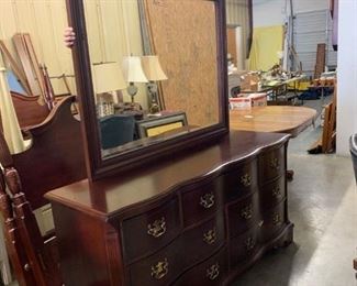 Bassett 7 drawer scalloped dresser with beveled mirror.  Mahogany.     64"w x 20"d x 32.5"t                           Very good condition      $225.                Also have matching nightstand and complete queen bed.