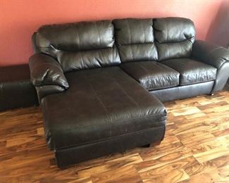 This leather sofa is oh, so comfy... perfect for TV binging or family room gatherings.