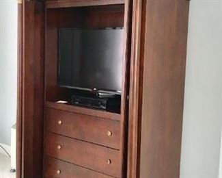 Cherry entertainment center with drawers