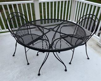 76. Wrought Iron Round Table and 2 Chairs (42")