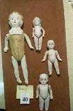 4 "Germany" dolls 3 bisque dolls tallest is 4 1/2"
one 8" mixed leather parts