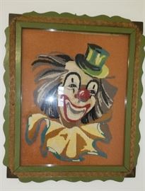 vintage frame with needlework of a happy clown