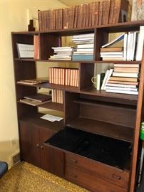 Mid Century wood wall unit or room divider with shelves, drop down desk, cabinet door and drawers.  