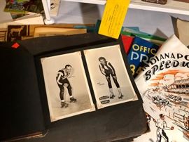 A scrap book filled with roller derby photos.