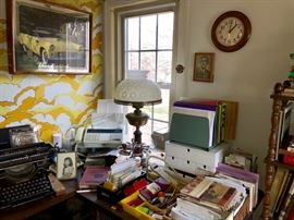 Lamp with milk glass shade, wall art and office miscellaneous.