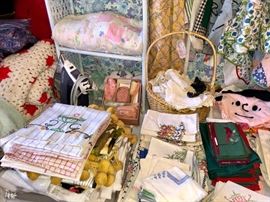 Rowenta iron, tea towels and embroidered dish towels.