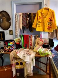 Ladies' scarves, men's ties and a school pennant jacket.