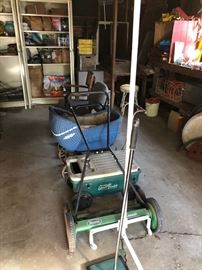 Push mower, cooler and wicker baby carriage.