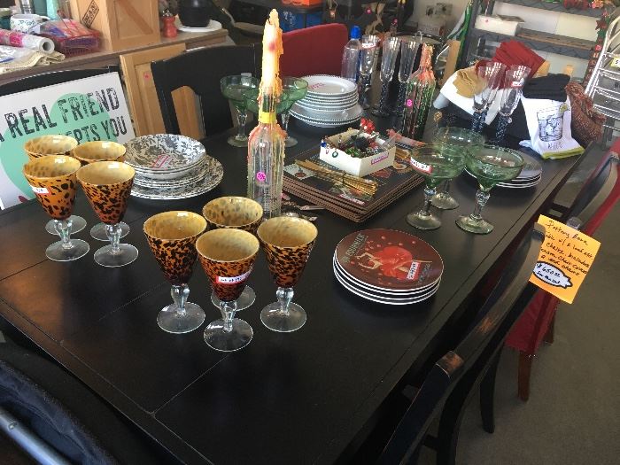 Assorted glassware, plates, wine stoppers, placemats