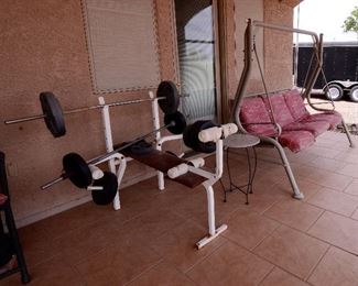 LARGE PATIO SWING ALONG WITH BARBELL GYM EXERCISE EQUIPMENT WEIGHT LIFTING EQUIPMENT.