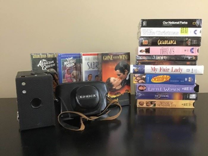 VHS tapes and a pair of vintage cameras    https://ctbids.com/#!/description/share/143328
