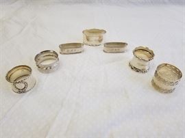 Qty (7) Antique, polished pieces of Sterling Silver Hollowware/Napkin Rings. Gorham sterling wreath B1546, Towle sterling silver flute 102, two (2) RLB Rogers, Lunt & Bowlen sterling napkin rings 454, Shreve & Co. sterling napkin ring 5817, floral art nouveau ring marked "Sterling 35", and Gorham sterling napkin ring B4182. All marked "Sterling". See pictures for complete details and makers marks. See additional Sterling Silver items offered in Lot 4A.