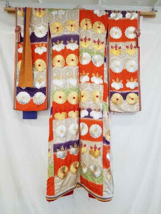 Vintage, authentic, silk, Shiro-Maku and Uchikake Bridal Wedding Kimono Set with Male Kimono. Includes two (2) bridal kimonos (Shiro-Maku and Uchikake) and one (1) male kimono. According to the estate owner, these kimonos were brought over to the U.S. in 1953 by a WWII bride from Japan.
The wedding kimono for the bride actually consists of two different kimonos. The traditional white Japanese wedding kimono is called Shiro-Maku. Shiro meaning white and Maku meaning pure. The white wedding kimono is worn for the wedding ceremony and then the elaborate, rich patterned silk brocade kimono called Uchikake is worn over the white kimono at the wedding reception. The kimono is made of silk and beautiful silk brocade. The kimono is rich in fine embroidered patterns and scenes of flowers and nature motifs embellish the kimono in rich color. 
This third kimono is a male kimono and is traditionally worn by men as daily wear clothing and generally are conservative in color.