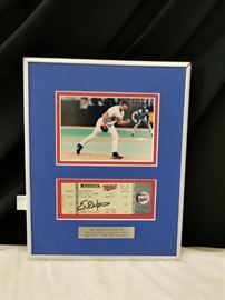 Picture and original ticket stub commemorating Minnesota Twins, Eric Milton "No-Hitter" mounted on frame. Approximate dimensions are 9.75" W X 12" H X 1" D. See other lots throughout auction for more baseball memorabilia.