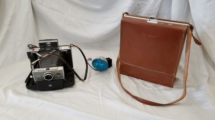 Vintage Polaroid Automatic 240 Land Camera. Comes with original case.
