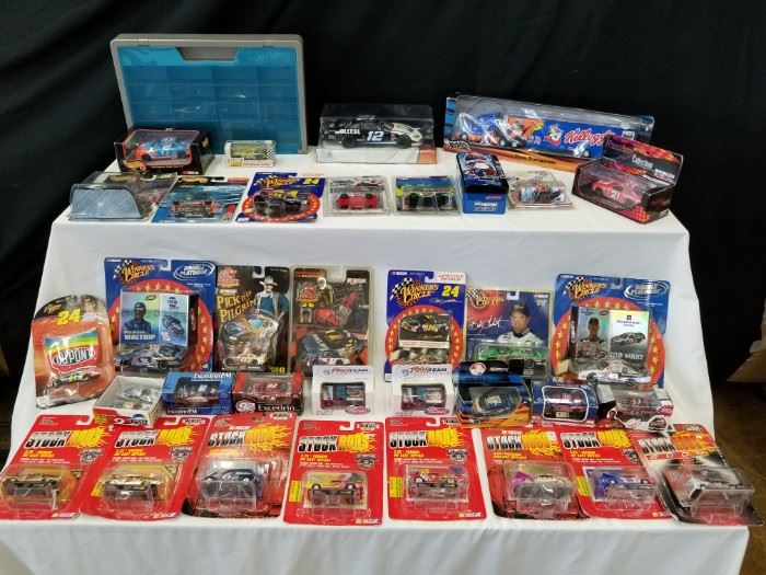Assortment of collectible die-cast metal and other collectible race cars. Most are new in packaging. Hot Wheels, Stock Rods, Race Image, and more. Please see pictures for complete details.