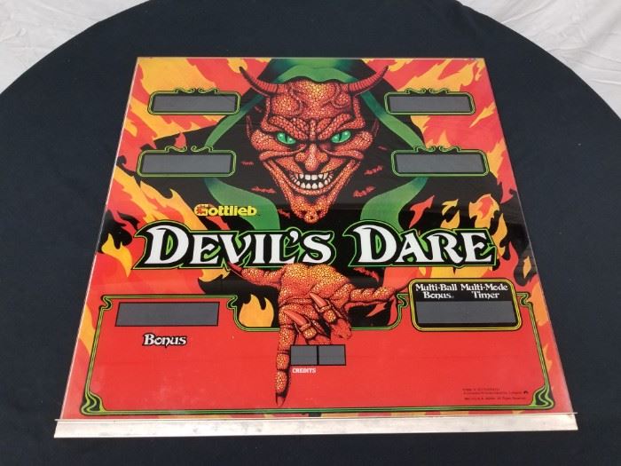Vintage, Original 1981 Gottlieb "Devil's Dare" Pinball Backglass Marquee. Very rare and hard to find! When this game was originally produced, the majority were exported, so these are considered quite a rarity in the United States, and still very hard to come by worldwide. Approximate dimensions are 26" W X 26" H. Please see all the additional pinball backglass and arcade game marquees that are offered throughout the auction.