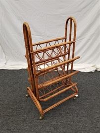 Vintage rattan magazine rack from 1970's. Approximate dimensions are 18.5" W X 16" D X 38" H. Matches lots 1A and 16.