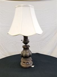 Ornate, vintage bronze metal lamp. The base of this lamp is a reproduction of an old French oil lamp. Lamp is 28" H.
