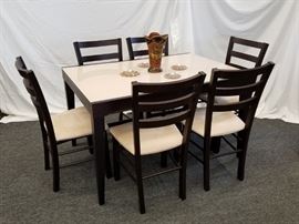 Calligaris, Italian made, Espresso colored, Extendable Dining Room Table with 6 chairs and "self-storing" leaf. This gorgeous, modern design, Calligaris dining table was made in Italy and has a glass surface with a built in "leaf" that slides out from underneath the tabletop. The top slides over and the "leaf" slides up from underneath, extending the 51.25" W table to a 90.5" W table. SEE PICTURES OF HOW IT WORKS!  Super cool! Table is heavy due to leaf being constructed into table. Table measures 51.25" W X 35.5" D X 30" H. Dimensions of table when extended are 90.5" W X 35.5" D X 30" H. Each chair has suede-like fabric seats and measures approximately 18" W X 16" D X 18" H at seat. X 36.5" H at back. Please bring proper help to remove.