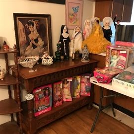 Carved, ornate foyer/ sofa table.  Selection of Barbie and Ken dolls