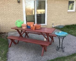 Wood picnic table. Terra cotta pots