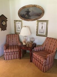 Matching upholstered chairs, end table to match coffee table, beautiful old painting, wall clock