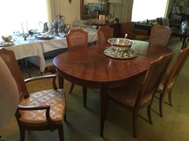 Matching dining table, with 8 chairs, additional leaves and pads.