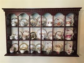 Demitasse cup and saucer collection (each sold separately) and display shelf.