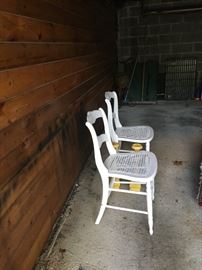 Two antique caned chairs
