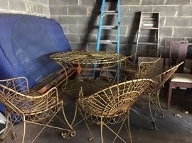 Antique wrought iron decorative garden set includes four chairs and custom glass top