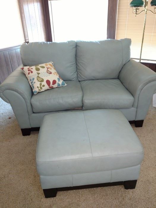 Like new light blue leather love seat with ottoman.