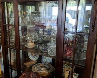 Very nice china cabinet in dining room.