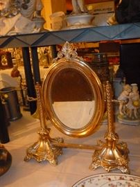 Candlesticks are Judaica, smuggled from Poland in WWII, made into a mirror with rosewood back