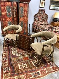 Pair of authentic Elk Antler club chairs sitting in front of a fantastic Austrian/Bavarian paint decorated armoire