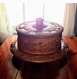 Wooden cake plate and cover on a lazy susan