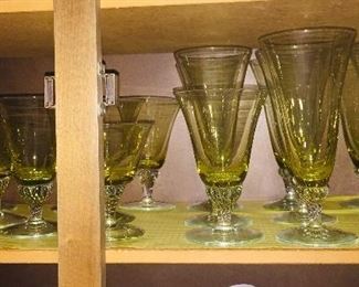 large assortment of Vaseline glass stemware