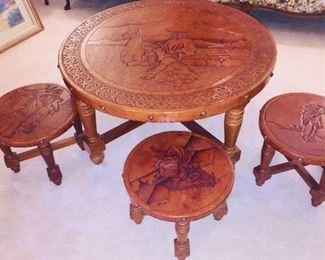 Peruvian leather tables with scenes from Peru carved into table tops--photo doesn't show their beauty