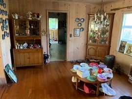 Hutch.  Coffee table.  Variety of china pieces.  Kitchen bistro table & 2 chairs.   