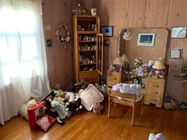 Vanity w/ mirror.  Tall cabinet w door and light.  Variety of plush animals.  Note cards.  Wreaths.  
