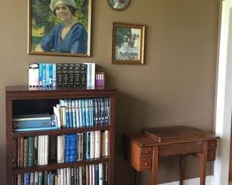 Large Collection of Sherlock Holmes mystery books, nice solid wood bookshelf and antique sewing machine cabinet
