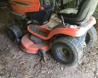 Lawn tractor that runs...we also have one for sale for parts.