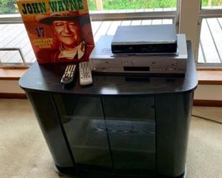 TV stand, VHS DVD player, misc VHS and DVDs.